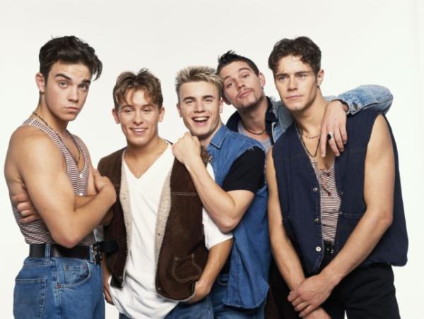 Take That in the 90s pose for a photo